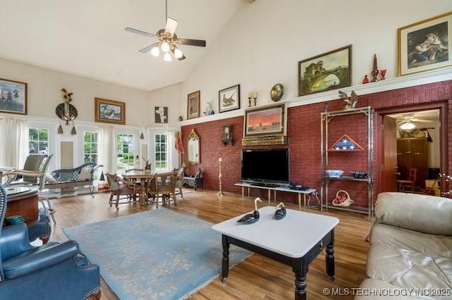 2403 S Troost Ave, Tulsa, OK 74114 - living room featuring a ceiling fan, high vaulted ceiling, and wood finished floors