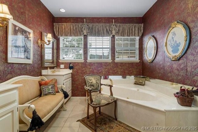 2403 S Troost Ave, Tulsa, OK 74114 - bathroom featuring wallpapered walls, a whirlpool tub, and tile patterned flooring