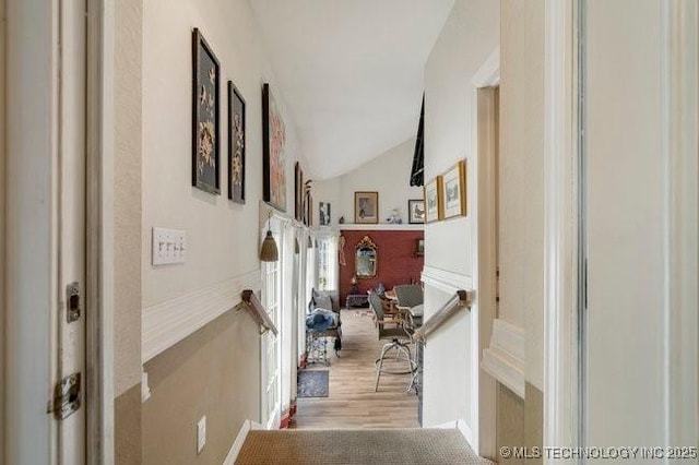 2403 S Troost Ave, Tulsa, OK 74114 - hall with lofted ceiling and wood finished floors