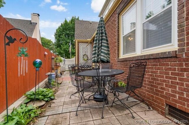2403 S Troost Ave, Tulsa, OK 74114 - view of patio with outdoor dining space