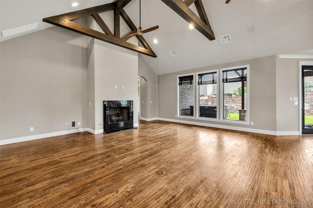 3805 S Tamarack Ave, Broken Arrow, OK 74011 - unfurnished living room with high vaulted ceiling, a high end fireplace, wood finished floors, beamed ceiling, and baseboards