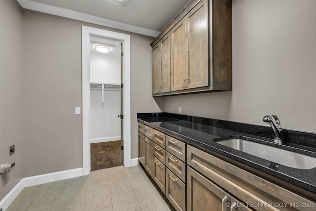 3805 S Tamarack Ave, Broken Arrow, OK 74011 - laundry room featuring cabinet space, baseboards, and hookup for an electric dryer