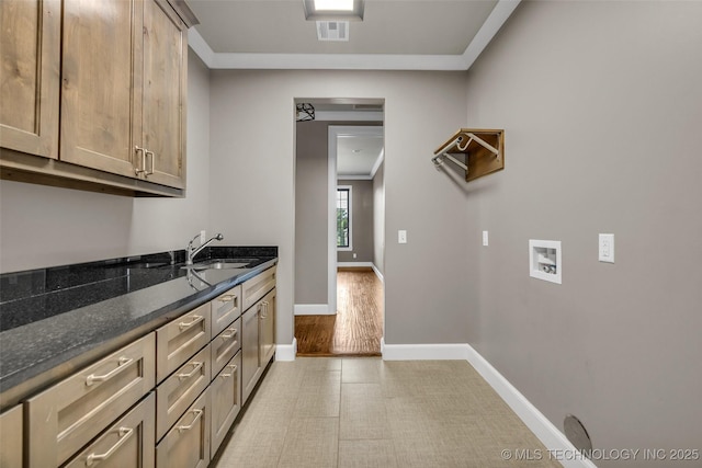 3805 S Tamarack Ave, Broken Arrow, OK 74011 - washroom with washer hookup, cabinet space, baseboards, and crown molding