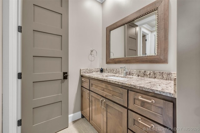 3805 S Tamarack Ave, Broken Arrow, OK 74011 - bathroom with vanity, baseboards, and tile patterned floors
