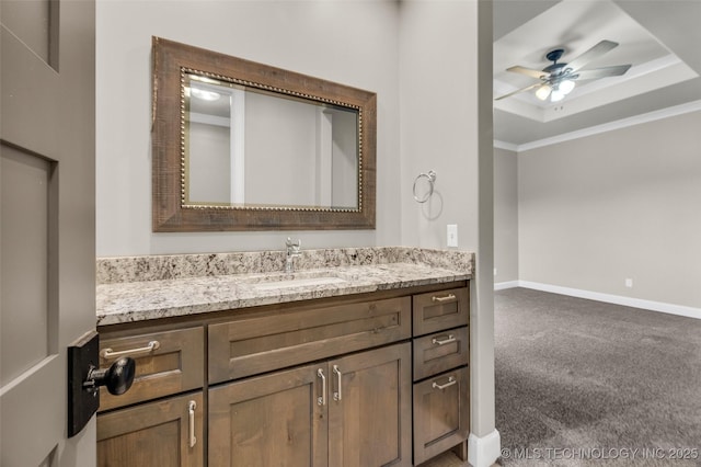3805 S Tamarack Ave, Broken Arrow, OK 74011 - bathroom featuring vanity, a ceiling fan, baseboards, and a tray ceiling