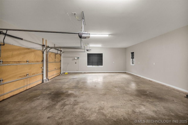 3805 S Tamarack Ave, Broken Arrow, OK 74011 - garage with baseboards and a garage door opener