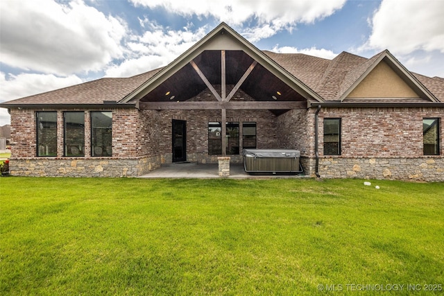 3805 S Tamarack Ave, Broken Arrow, OK 74011 - back of property featuring a hot tub, a patio area, a shingled roof, and a lawn