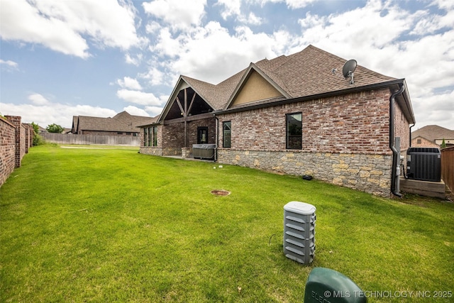 3805 S Tamarack Ave, Broken Arrow, OK 74011 - rear view of house featuring central AC unit and roof with shingles