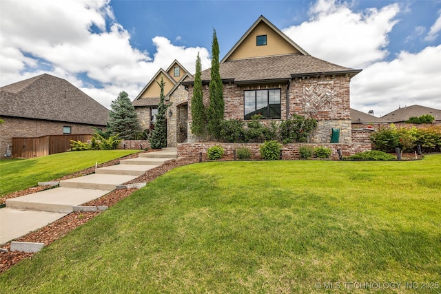 3805 S Tamarack Ave, Broken Arrow, OK 74011 - view of front facade featuring a front lawn, roof with shingles, brick siding, and stucco siding