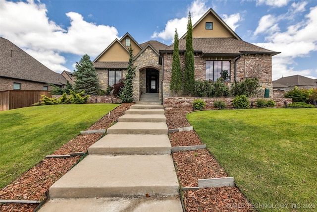 3805 S Tamarack Ave, Broken Arrow, OK 74011 - view of front of property featuring stone siding, stucco siding, a shingled roof, and brick siding