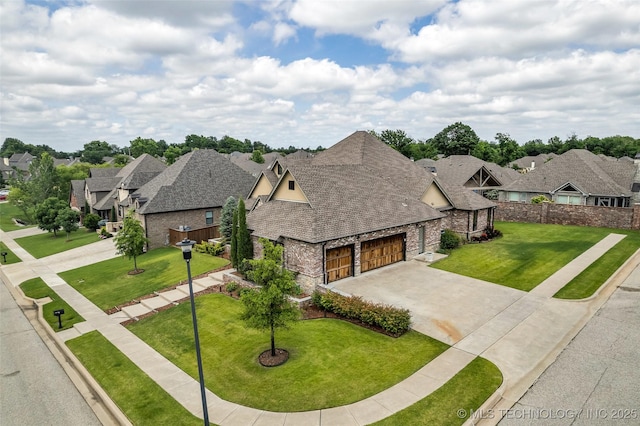 3805 S Tamarack Ave, Broken Arrow, OK 74011 - view of front facade featuring stone siding, concrete driveway, an attached garage, a residential view, and roof with shingles