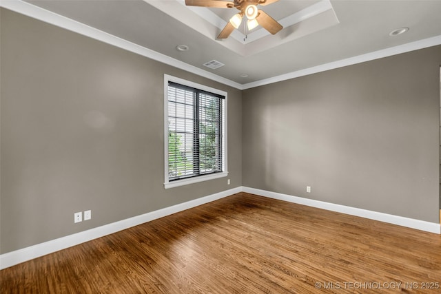 3805 S Tamarack Ave, Broken Arrow, OK 74011 - spare room with a raised ceiling, baseboards, wood finished floors, a ceiling fan, and crown molding