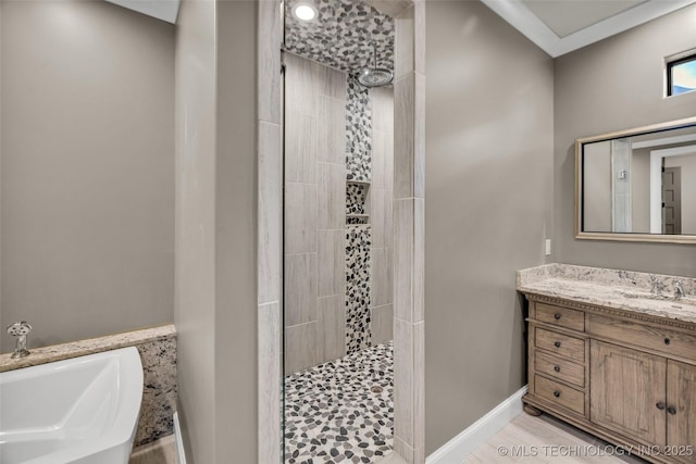 3805 S Tamarack Ave, Broken Arrow, OK 74011 - full bath featuring tiled shower, vanity, a garden tub, and baseboards