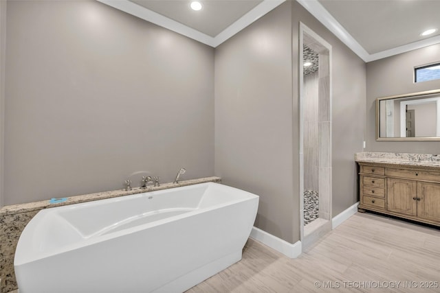 3805 S Tamarack Ave, Broken Arrow, OK 74011 - full bathroom featuring a soaking tub, vanity, a shower stall, recessed lighting, and baseboards