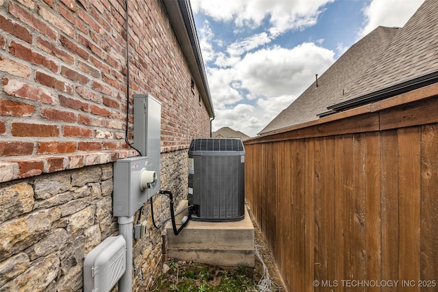 3805 S Tamarack Ave, Broken Arrow, OK 74011 - view of side of property featuring central air condition unit and brick siding