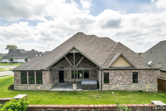 3805 S Tamarack Ave, Broken Arrow, OK 74011 - back of house with a hot tub, roof with shingles, a patio, and a lawn