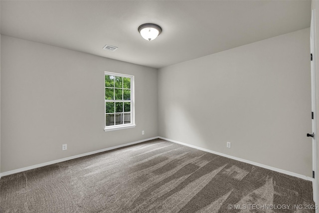 9220 S 256th E Ave, Broken Arrow, OK 74014 - spare room featuring dark carpet and baseboards