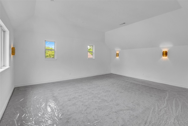 3121 S Rockford Dr, Tulsa, OK 74105 - bonus room with lofted ceiling, baseboards, and carpet floors