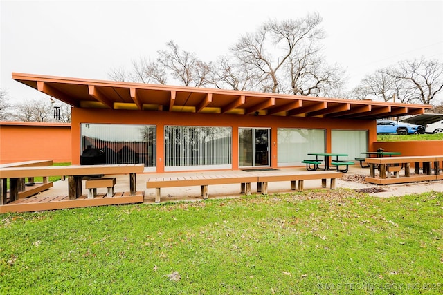 2664 Spence, Sulphur, OK 73086 - back of property featuring a yard and a wooden deck