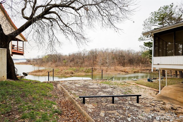 2664 Spence, Sulphur, OK 73086 - view of yard featuring a sunroom and a water view