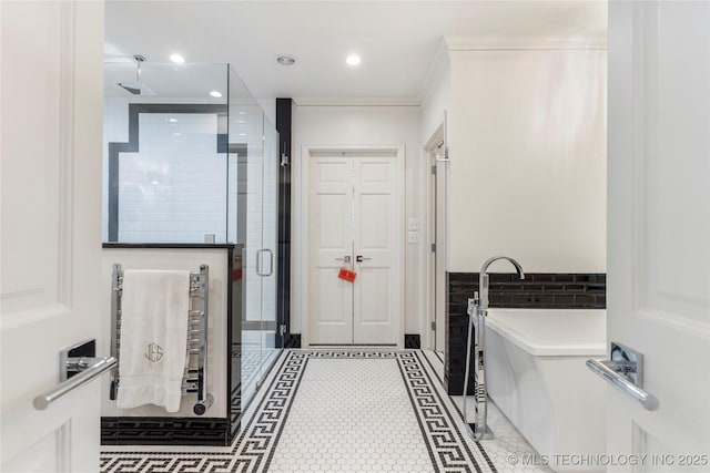 1764 E 30th St, Tulsa, OK 74114 - full bathroom featuring a shower stall, inlaid floor details, a freestanding bath, and recessed lighting