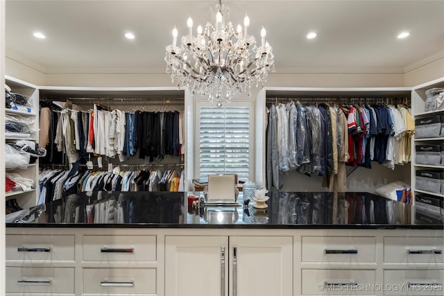 1764 E 30th St, Tulsa, OK 74114 - walk in closet featuring a chandelier