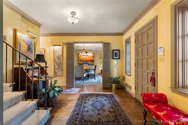 1764 E 30th St, Tulsa, OK 74114 - foyer entrance with stairway, a chandelier, crown molding, and baseboards