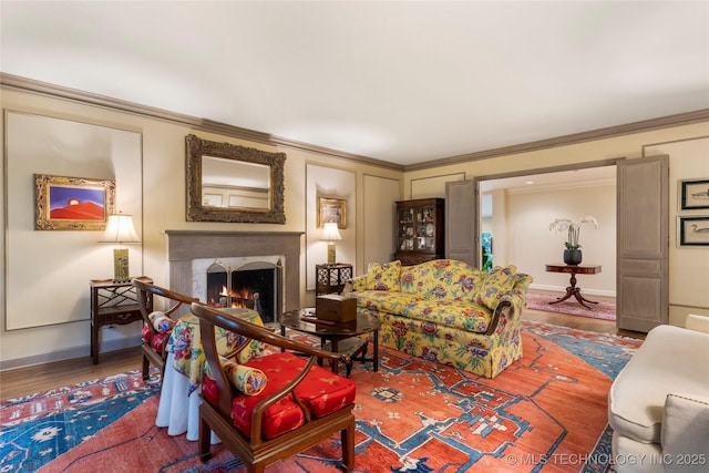 1764 E 30th St, Tulsa, OK 74114 - living room featuring wood finished floors, baseboards, a lit fireplace, and crown molding