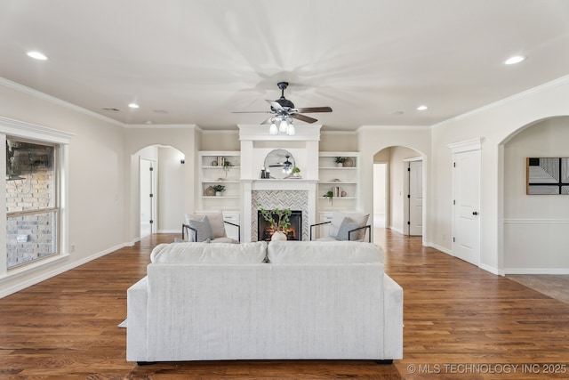16121 E 78th St, Owasso, OK 74055 - living room featuring arched walkways, ceiling fan, recessed lighting, crown molding, and wood finished floors