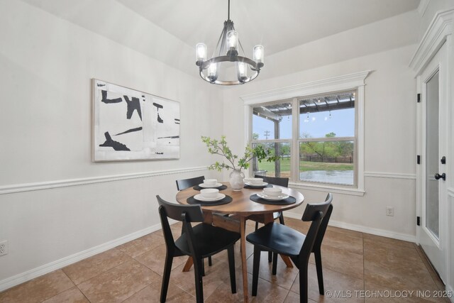 16121 E 78th St, Owasso, OK 74055 - tiled dining space with a chandelier and baseboards