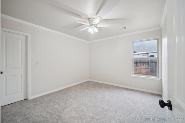 16121 E 78th St, Owasso, OK 74055 - spare room featuring carpet flooring, ceiling fan, ornamental molding, and baseboards