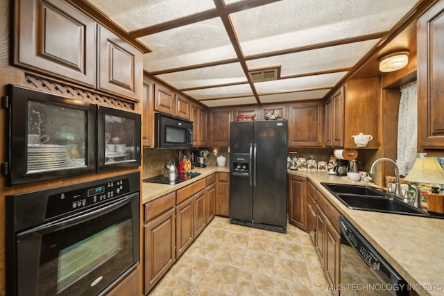 3504 S Rolling Oaks Dr, Tulsa, OK 74107 - kitchen featuring black appliances, light countertops, and decorative backsplash