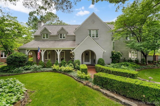 2508 Terwilleger Blvd, Tulsa, OK 74114 - view of front of house with a chimney, a front lawn, and roof with shingles