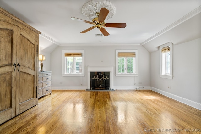 2508 Terwilleger Blvd, Tulsa, OK 74114 - unfurnished living room featuring healthy amount of natural light, crown molding, light wood finished floors, baseboards, and a ceiling fan