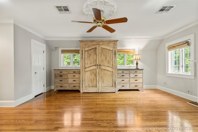 2508 Terwilleger Blvd, Tulsa, OK 74114 - unfurnished bedroom featuring multiple windows, baseboards, light wood-style floors, and ornamental molding