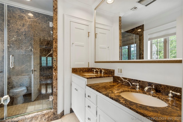 2508 Terwilleger Blvd, Tulsa, OK 74114 - bathroom with crown molding, a stall shower, double vanity, toilet, and tile patterned flooring