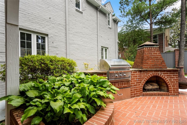2508 Terwilleger Blvd, Tulsa, OK 74114 - view of patio / terrace featuring an outdoor brick fireplace