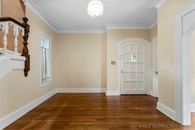 2508 Terwilleger Blvd, Tulsa, OK 74114 - entryway with wood finished floors, a chandelier, plenty of natural light, crown molding, and arched walkways