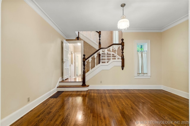 2508 Terwilleger Blvd, Tulsa, OK 74114 - unfurnished living room with baseboards, stairs, wood finished floors, crown molding, and a chandelier
