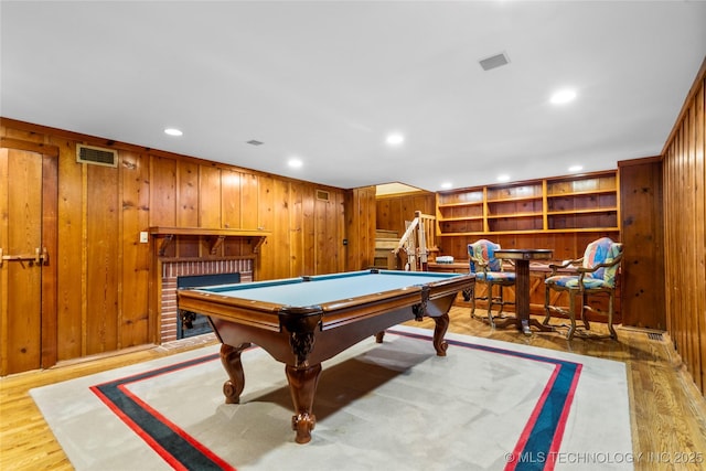 2508 Terwilleger Blvd, Tulsa, OK 74114 - playroom featuring wooden walls, pool table, recessed lighting, light wood finished floors, and a fireplace