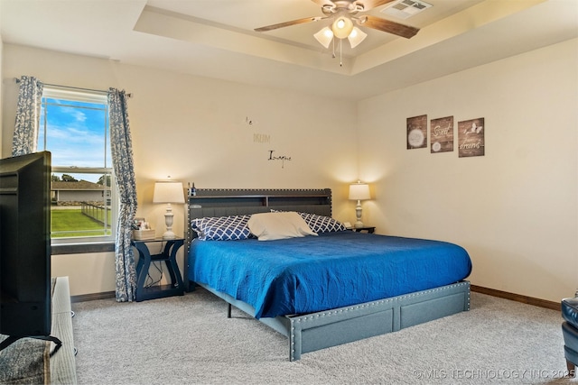 12175 Rustic Acres Ln, Overbrook, OK 73453 - bedroom featuring carpet floors, baseboards, and a tray ceiling