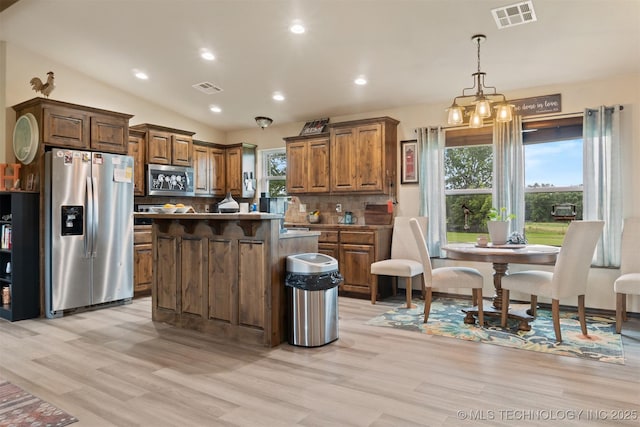 12175 Rustic Acres Ln, Overbrook, OK 73453 - kitchen featuring stainless steel appliances, backsplash, light wood finished floors, plenty of natural light, and recessed lighting