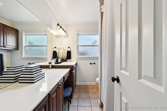 2653 S Vandalia Ave, Tulsa, OK 74114 - full bathroom with vanity, ornamental molding, plenty of natural light, and tile patterned flooring