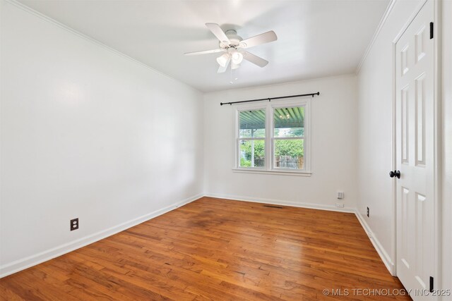 2653 S Vandalia Ave, Tulsa, OK 74114 - empty room with wood finished floors, a ceiling fan, and ornamental molding