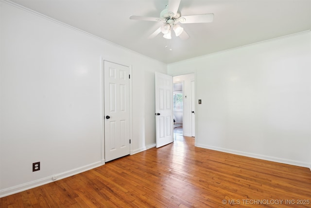 2653 S Vandalia Ave, Tulsa, OK 74114 - spare room with ornamental molding, a ceiling fan, and wood finished floors
