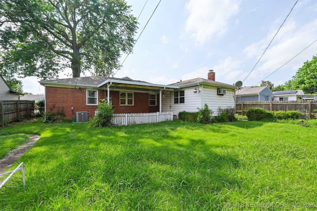 2653 S Vandalia Ave, Tulsa, OK 74114 - back of house featuring brick siding and a chimney