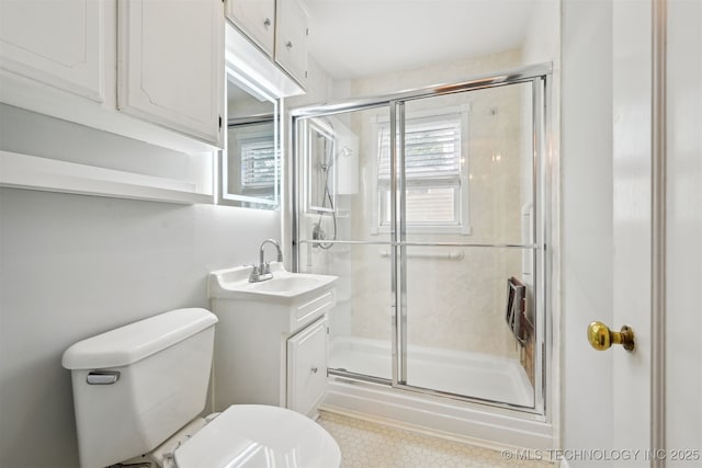 6315 E 5th Pl, Tulsa, OK 74112 - bathroom featuring toilet, a stall shower, and vanity
