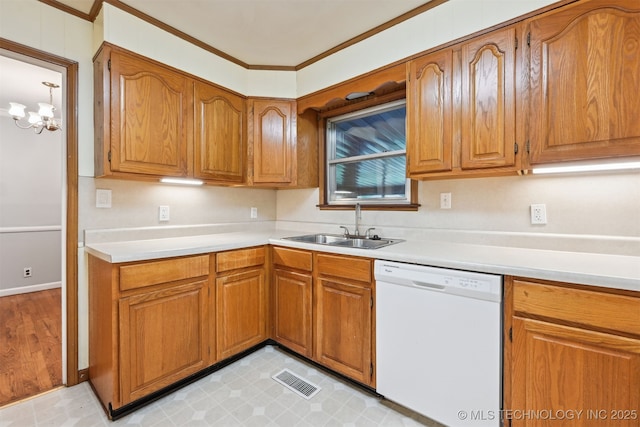 6315 E 5th Pl, Tulsa, OK 74112 - kitchen featuring white dishwasher, a sink, brown cabinetry, light countertops, and crown molding
