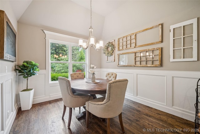 10350 E 122nd St S, Bixby, OK 74008 - dining area with vaulted ceiling, a chandelier, a decorative wall, dark wood finished floors, and a wainscoted wall