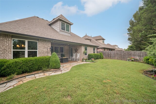 10350 E 122nd St S, Bixby, OK 74008 - rear view of house with brick siding, a shingled roof, and a patio area